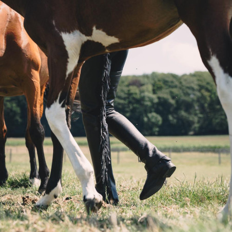 Chaps lunghe Dy'on in pelle artificiale con frange