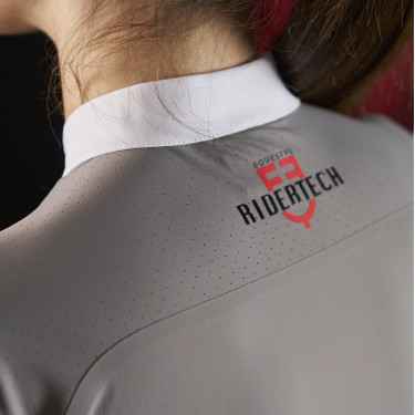Polo da concorso donna Equestro Ridertechnology a maniche lunghe con zip Polo da concorso donna Equestro Ridertechnology a maniche lunghe con zip